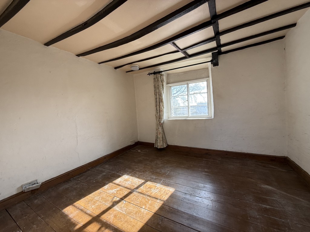 Lot: 26 - TWO-BEDROOM COTTAGE FOR IMPROVEMENT IN POPULAR DEVON VILLAGE - Primary Bedroom